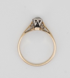 A solitaire diamond ring, collet-set with an antique circular-cut diamond weighing approximately 0.20 carats, mounted in 9ct gold, size L, British hallmarks, gross weight approximately 1.8 grams, Condition: fair